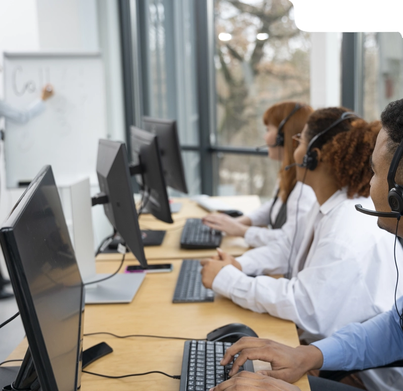 People working at computers with text about AI helping with claim management.