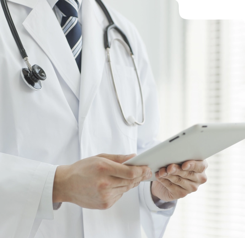 Doctor using a digital tablet for billing or patient management tasks