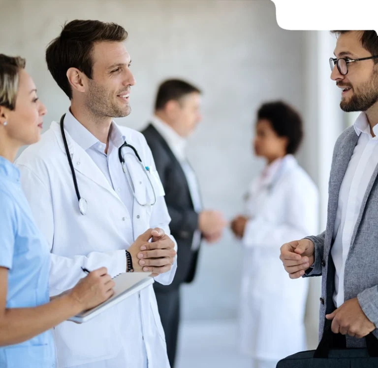 Independent healthcare professionals discussing billing solutions in a clinical setting